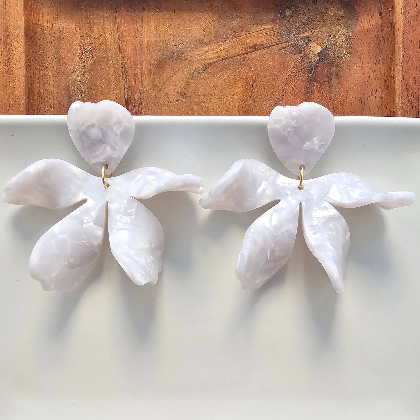 Elegant jasmine pearl earrings by Spiffy & Splendid featuring round white pearls with silver hooks.