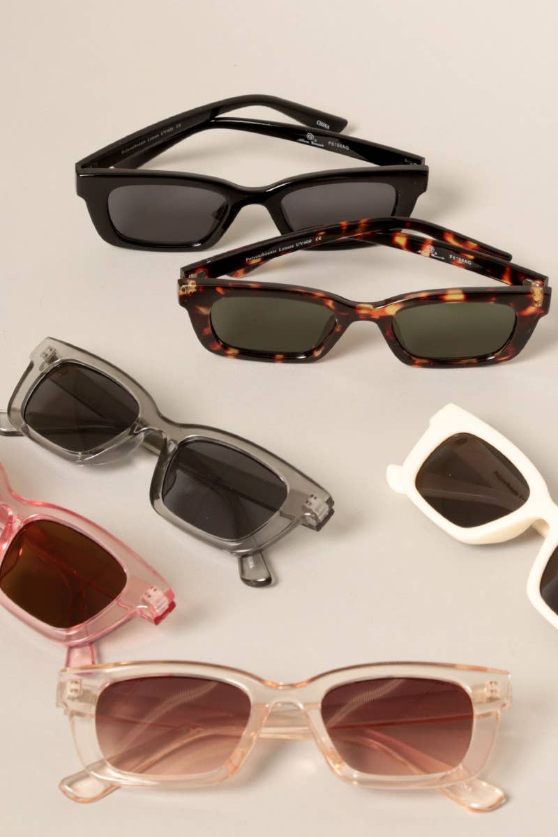 Fashion City Mini Classic Sunnies featuring round black frames and tinted lenses, stylish and compact eyewear for everyday wear.