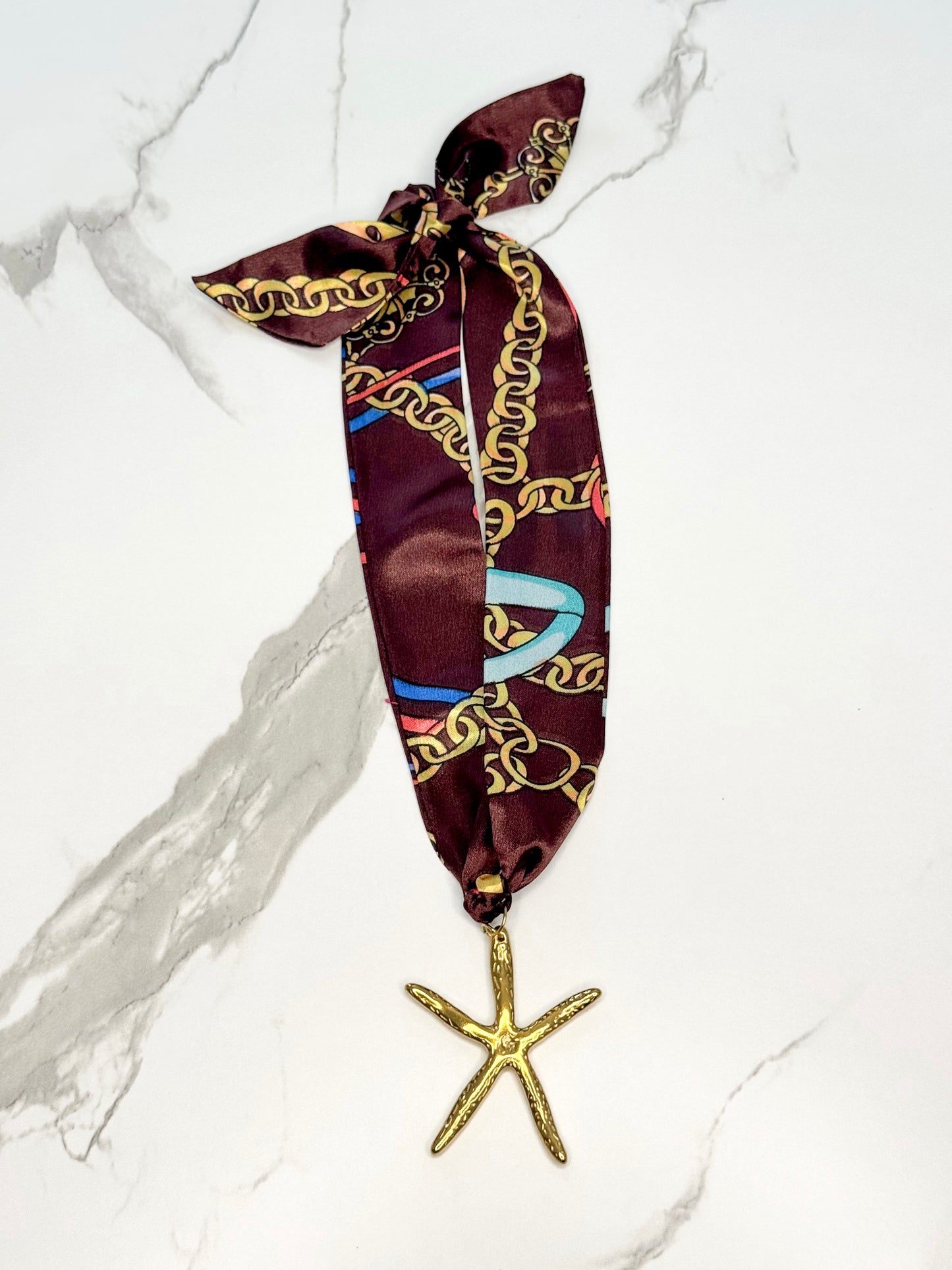 ChanSutt scarf necklace by Can't Hide Pretty Boutique featuring a stylish fabric scarf with a decorative chain detail.