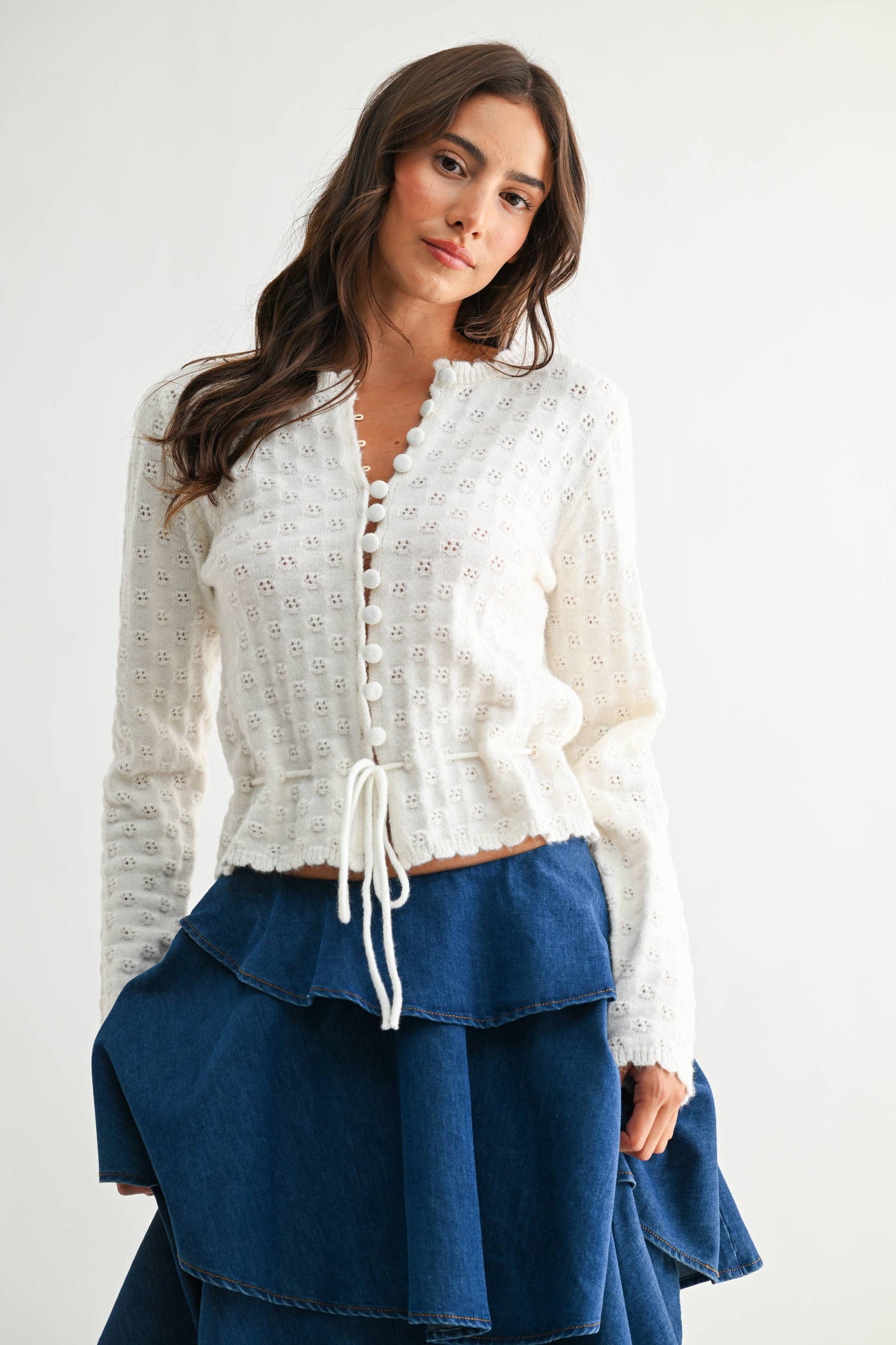Camellia Snow White cardigan with long sleeves and button front, soft knit fabric, and ribbed cuffs on a neutral background