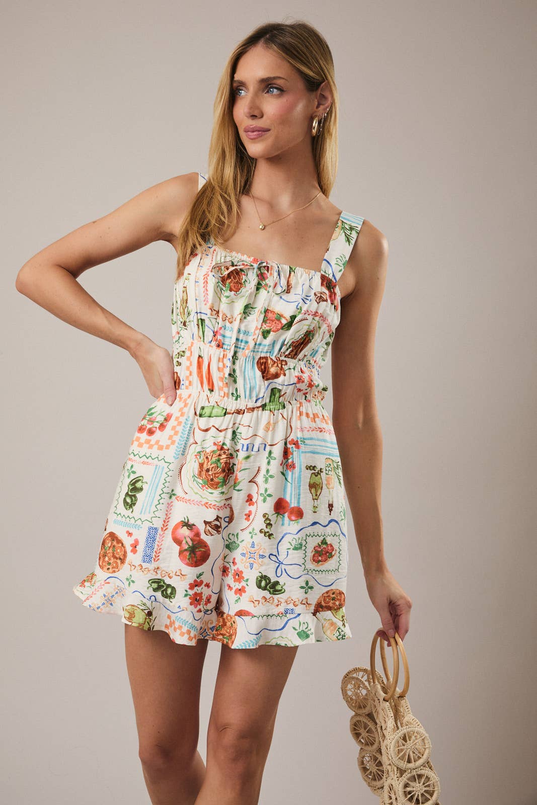 Sunday Edition Wanderlust Romper displayed on a model, featuring lightweight fabric, sleeveless design, and casual summer style.