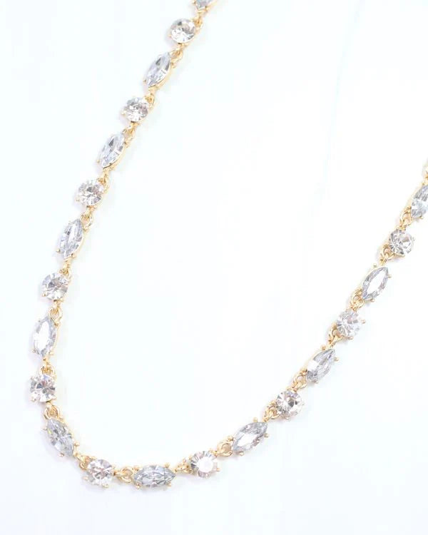 Clear rhinestone necklace from Can't Hide Pretty Boutique featuring sparkling rhinestones and a delicate chain.
