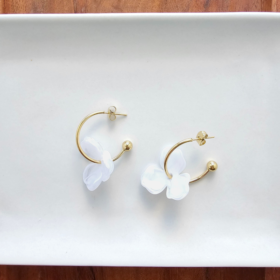 Spiffy & Splendid Magnolia Hoops featuring elegant gold hoop earrings with floral-inspired design and intricate detailing.