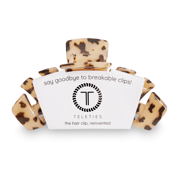 Blonde tortoise large TELETIES claw hair clip showcasing a sleek, stylish accessory for securing hair in a natural style.