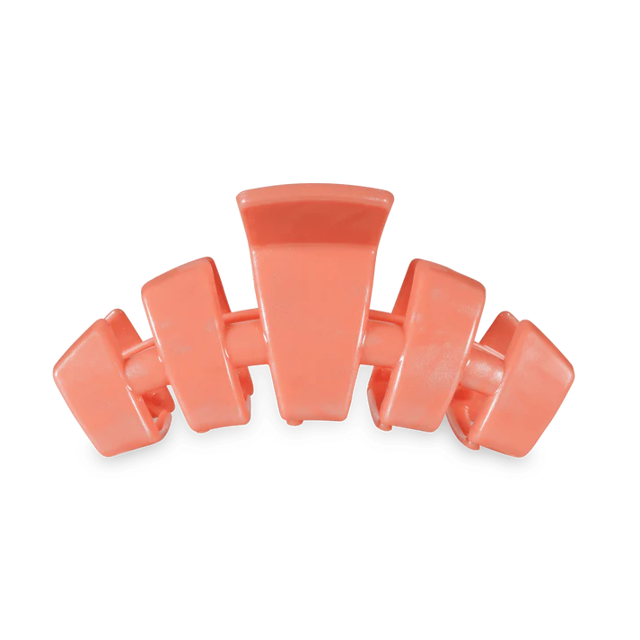 TELETIES Classic Dreamsicle Medium Claw Hair Clip shown on a hair strand, showcasing its colorful design and secure grip.