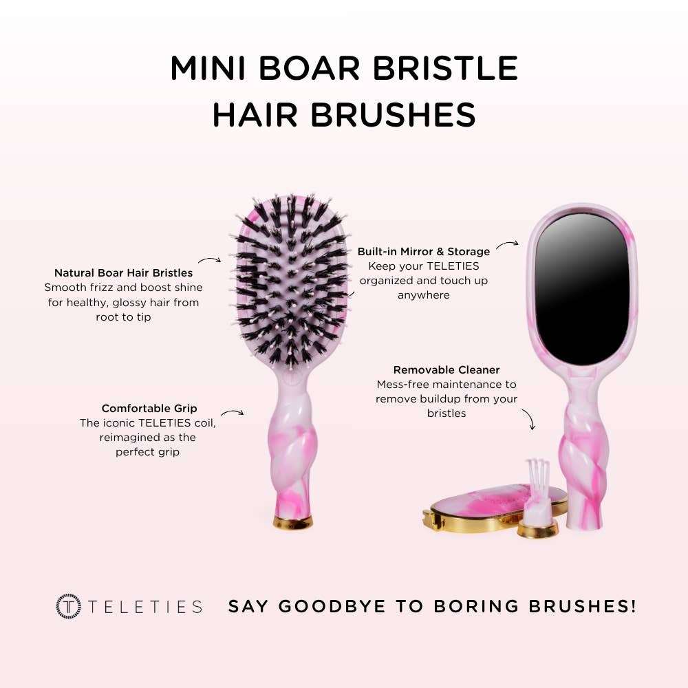Mini boar brush by TELETIES with natural wood handle and dense boar bristles for gentle hair styling and detangling.