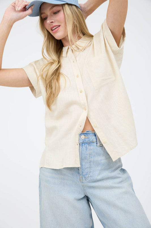 Luverne Collared Top by Can't Hide Pretty Boutique, featuring a stylish collar and fitted design, displayed on a hanger.