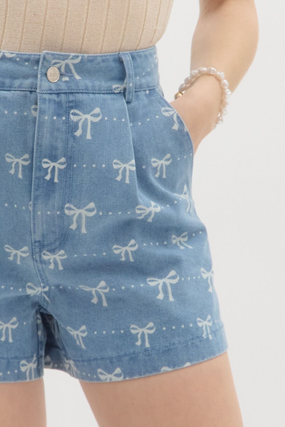 Light blue Coquette denim shorts from Can't Hide Pretty Boutique, featuring distressed details and classic five-pocket design.