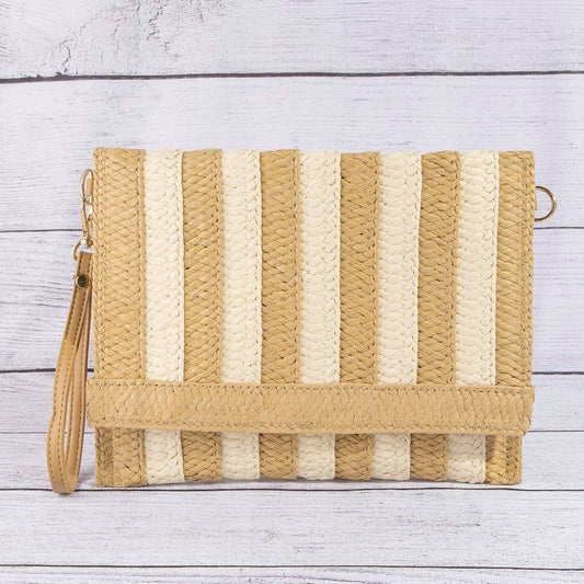 Two-tone striped straw clutch bag with a sleek design, featuring natural and bold colors, perfect for casual or summer occasions.