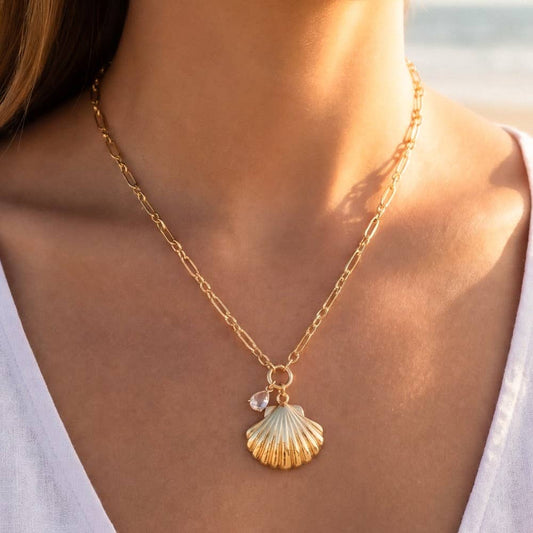 Seashell pendant necklace from Can't Hide Pretty Boutique featuring a delicate natural shell charm on a silver chain.