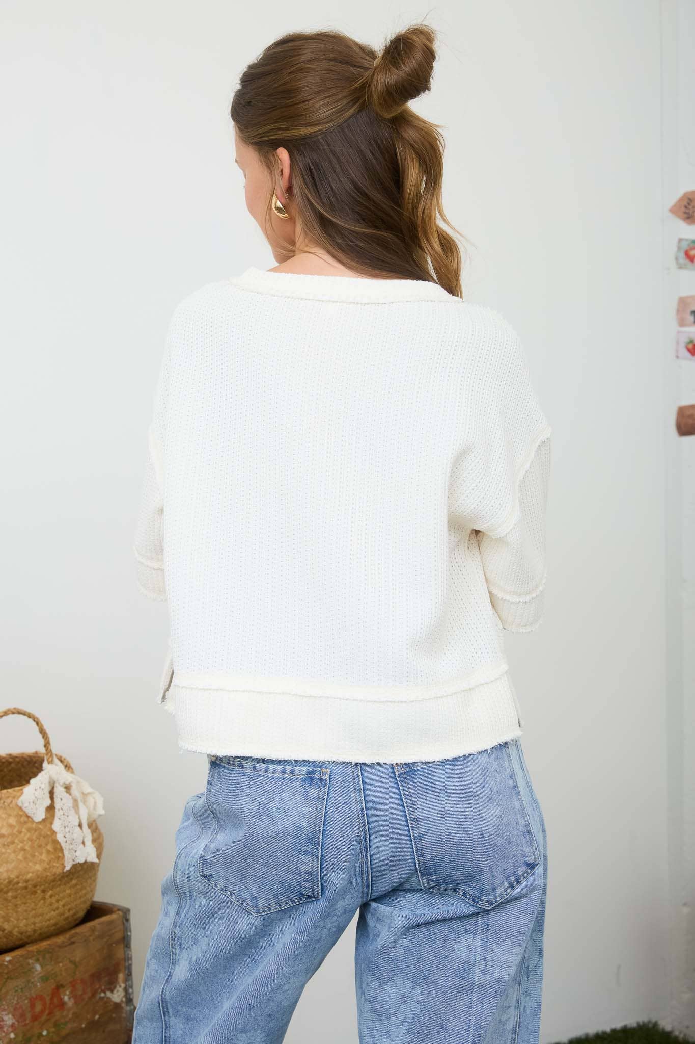 Blu Pepper raw edge henley short sleeve waffle knit top, close-up of the textured fabric and casual fit.